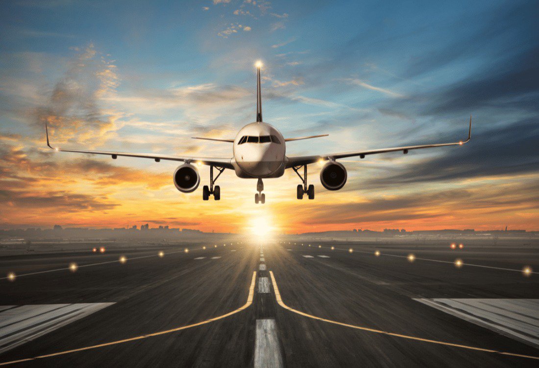 An airplane taking off from a runway with the crash alarm systems ready if needed.