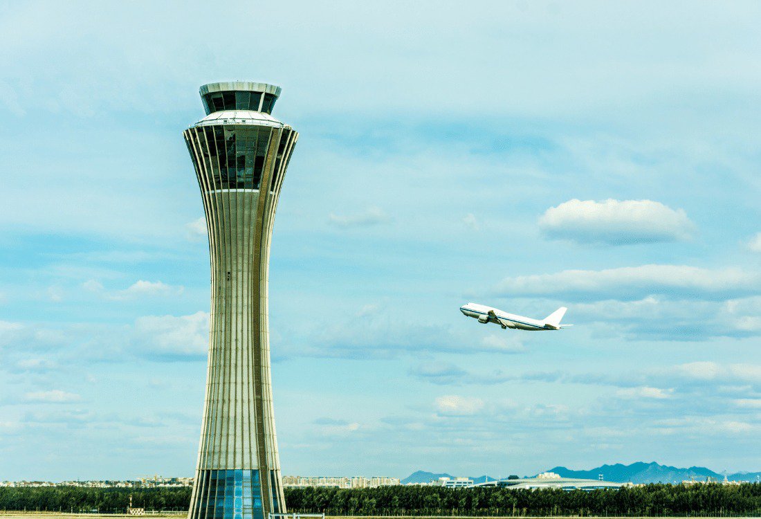 An ATC tower using flight data management systems to increase efficiency in the airport.